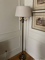 Full view of lamp with shade in room corner