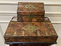 Front view closed showing burl walnut veneer and brass mounts