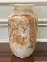 Front view showing marbled alabaster vase with flared rim