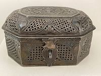 Front and top view of silver Etrog box showing latch and cut-out design