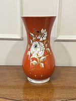 Full front view of orange Wallendorf vase