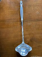 Full front view of 15-inch silverplate ladle