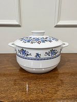 Front view of covered casserole showing floral band and lid