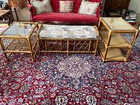 Bench and two rattan side tables on rug
