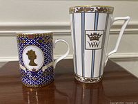 Front view of both mugs showing designs