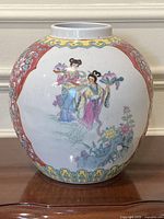 Front view showing female figures and overall shape