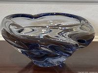 Angled front view showing blue swirl design and form