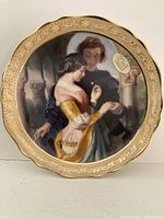 Front view of plate showing full artwork and gold rim