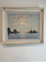 Framed painting on wall