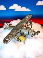 Angled view showing airplane top and wing star emblems over cloud backdrop