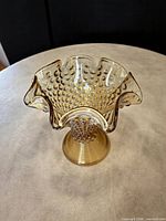 Overall view showing ruffled rim and footed base