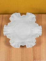 Top view showing ruffled rim and smooth interior