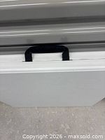 Folded table showing carry handle