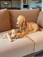 Mother and puppy figurines full view on sofa