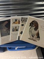 Four ads fanned out showing fronts