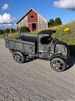 Side view of cast iron dump truck outdoors