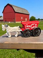 Side view showing full wagon, horse, logo, wheels