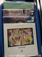 Front view showing all four album covers stacked