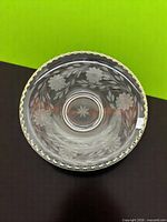 Top view showing entire bowl, etched floral design and scalloped gold-toned rim