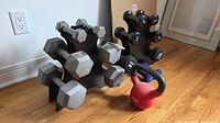 Hex dumbbells on rack with kettlebell visible