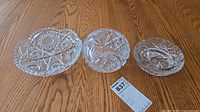 Three lead crystal bowls side by side showing relative sizes and patterns