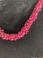 Close-up of ruby chip beads and spacer beads