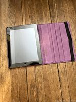 iPad inside open purple folio case showing screen and interior ridges