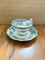 Teacup on saucer showing pattern and colors