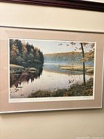 Framed print on wall showing full artwork, mat and frame