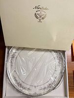 Boxed Noritake plate showing brand logo on lid