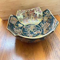 Oblique view of bowl interior showing painted panels and gilding