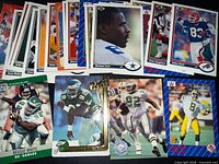 Overhead view of majority of the 30 football cards spread out