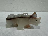 Left side view of banded agate rhinoceros figurine