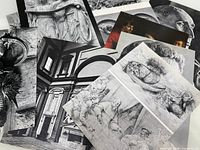 stack of assorted art and photo prints on paper and cardstock