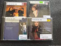 Front covers of all four CD cases