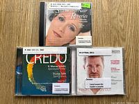 Front covers of all three CDs showing titles and artists