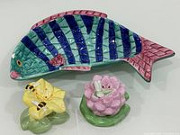Top view of fish dish and two floral shakers