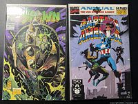 Front covers of both comic books in sleeves