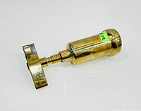 Side view of brass cylindrical corkscrew with sheath attached