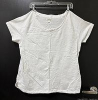Front view of white plus 2X T-shirt on hanger