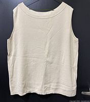 Front view of beige sleeveless knit sweater vest