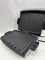 Open grill showing both non-stick ridged plates