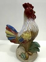 Left side view of multicolour ceramic rooster