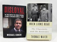 Front covers of both hardcover books with dust jackets visible