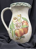 Front view showing fruit motif and overall shape