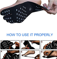 Demonstration of pad applied to foot showing black pad with white dots and split-toe shape