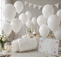 multiple inflated white balloons displayed with packaged roll in foreground