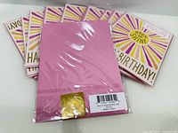 Rear view showing pink envelope and barcode