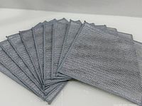 Full set of ten mesh scrub pads fanned out