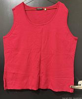 Front view of red Notations tank top showing overall condition and design